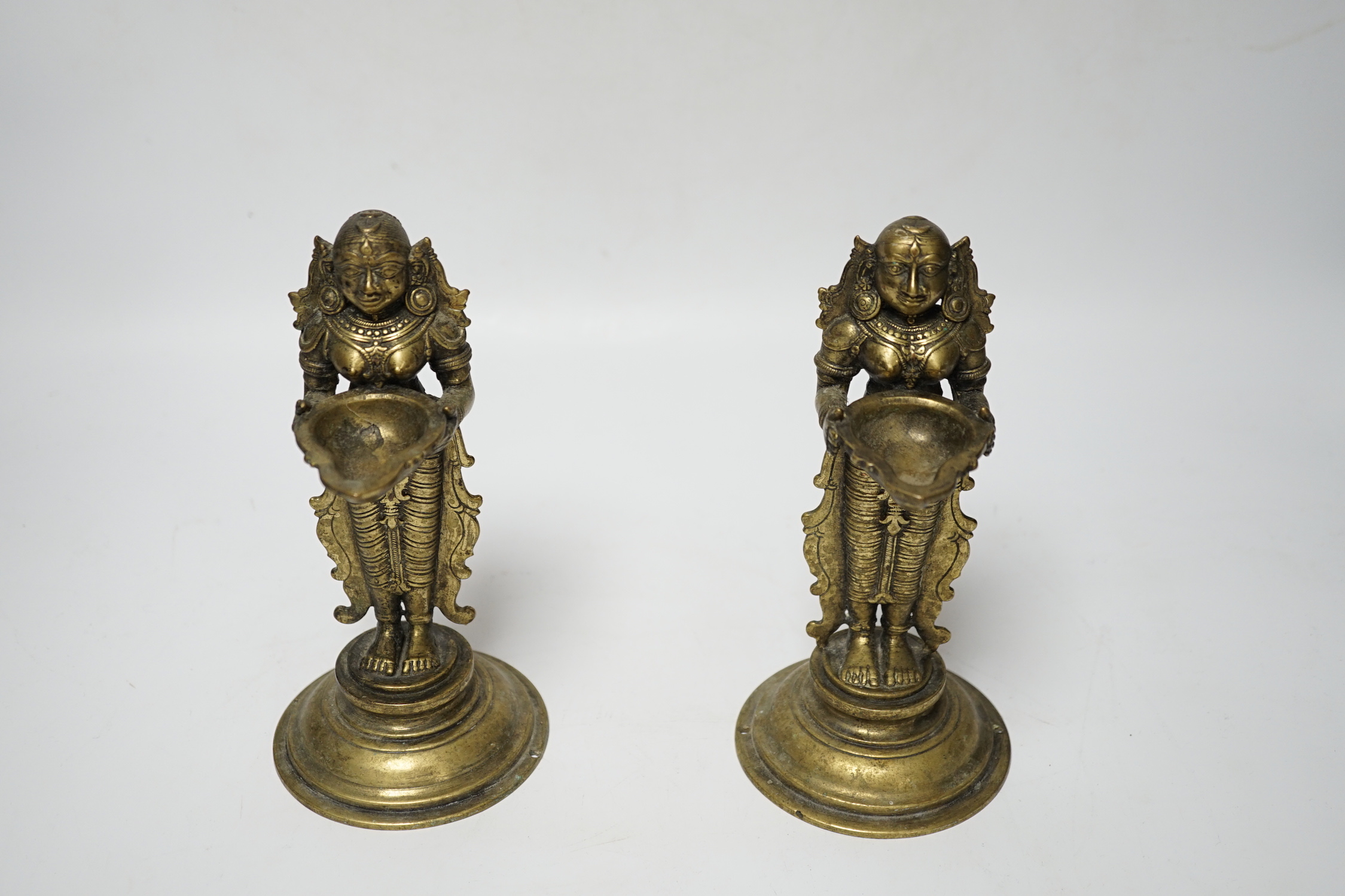 A pair of 19th century Indian ‘Deepalakshni’ butter oil lamps, 19cm high